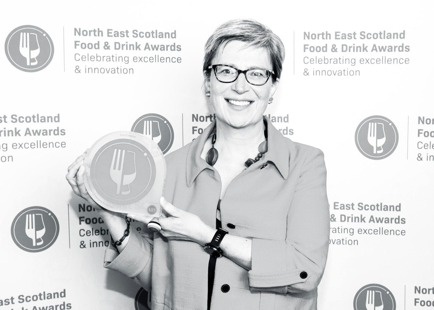 Helen holding our NES award 