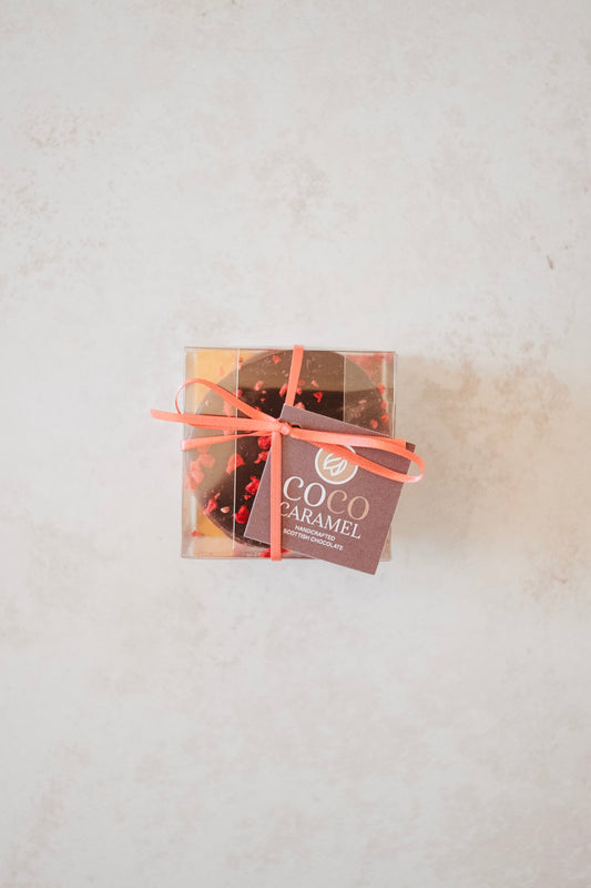 box of chocolates with pink ribbon 